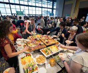 People eating at the opening mixer